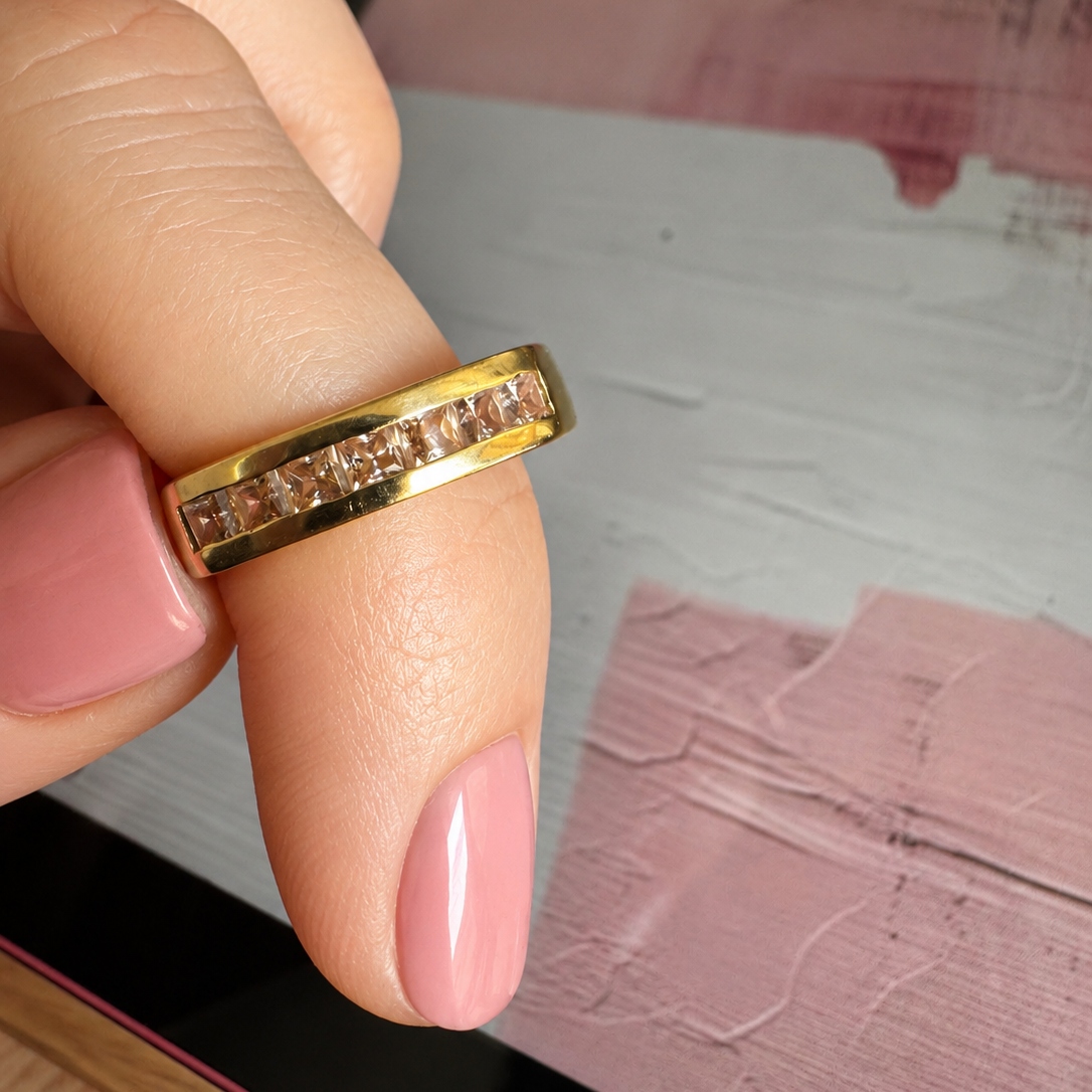 18k004 - Anillo de oro 18K con topacios